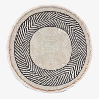 Flat-back wall baskets handwoven in Zimbabwe.